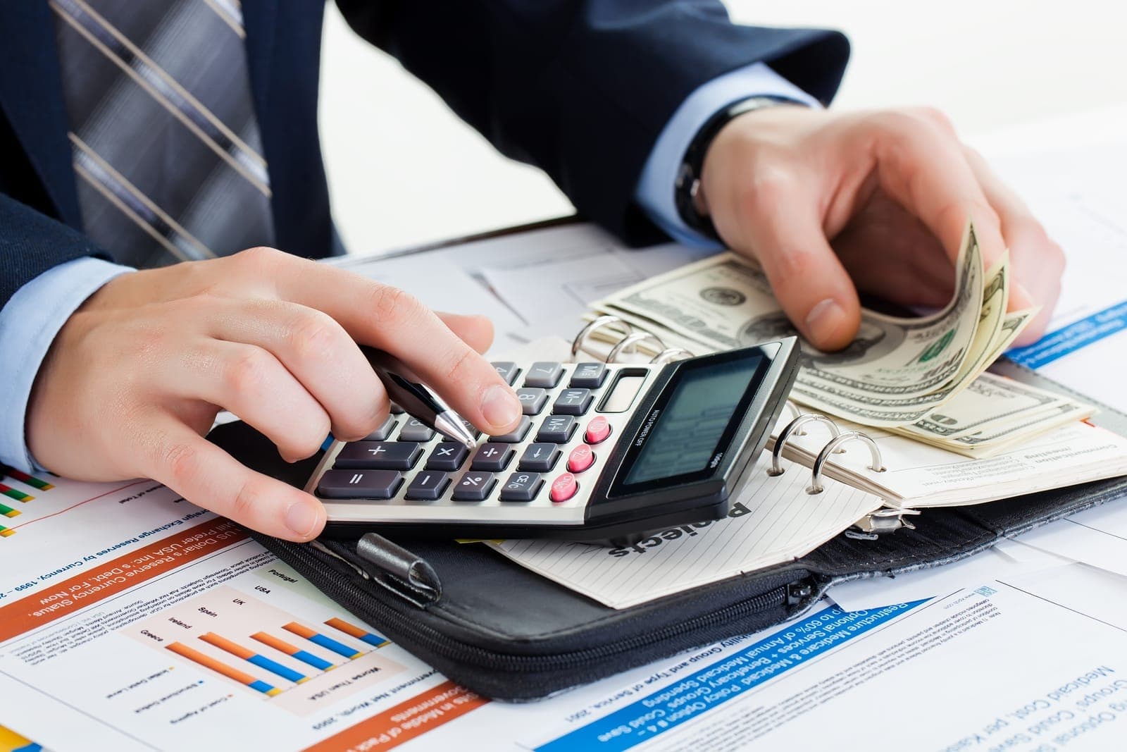 Calculating tax deductions with documents and a calculator