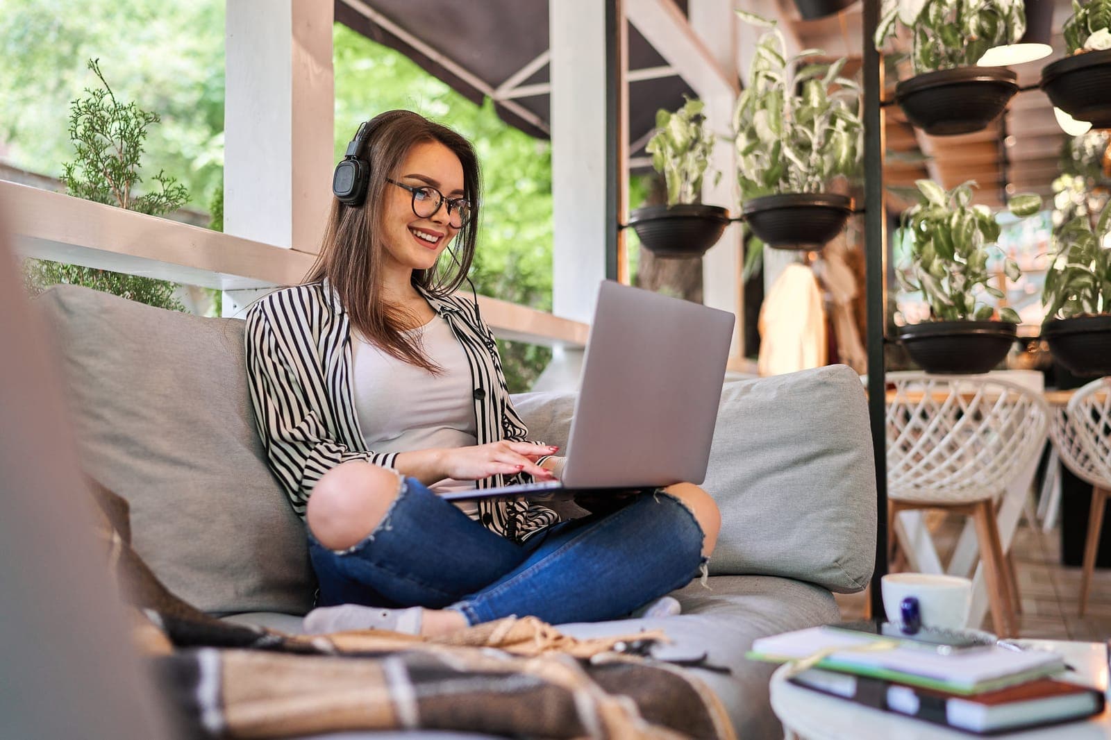 A person relaxing while lodging their tax return online on a laptop